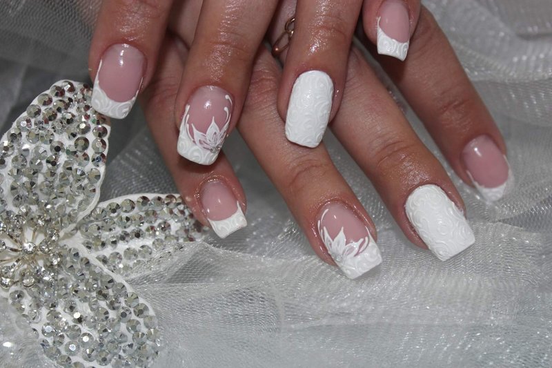 Wedding manicure with a convex vintage pattern and a flower