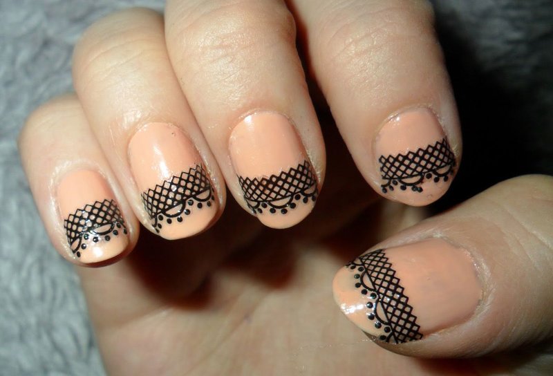 Nude manicure with black lace