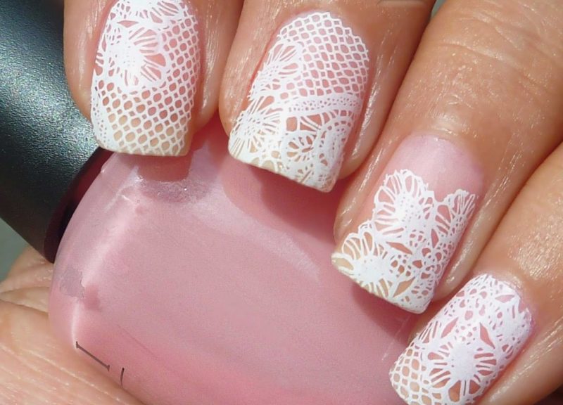 Lace wedding manicure on a pink varnish