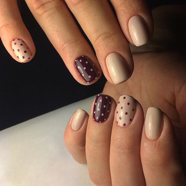 Nail manicure with dots and color Marsala.