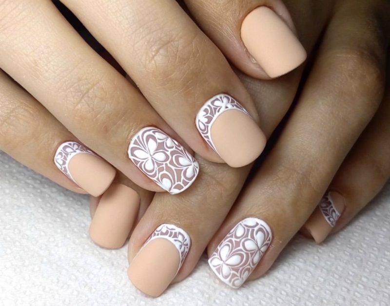 Matte nude nails with white holes and patterns