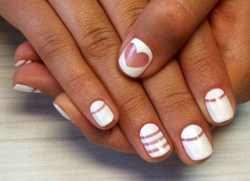 White manicure with geometry and a heart