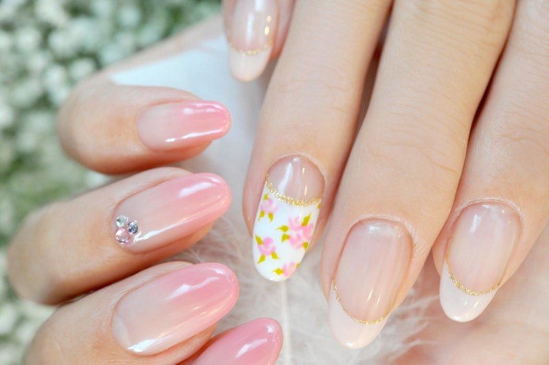 Swedish manicure ombre with a beige jacket and flowers