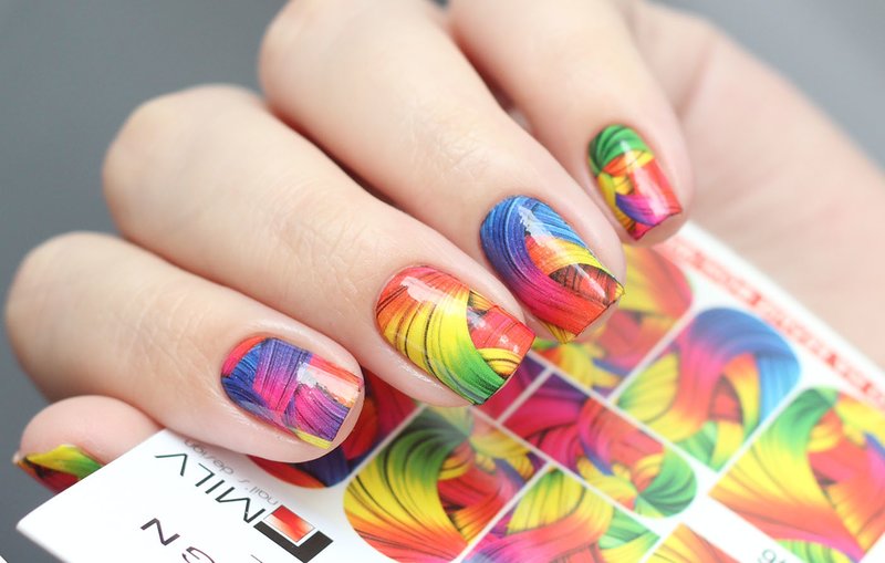 Multi-colored abstraction slides on nails