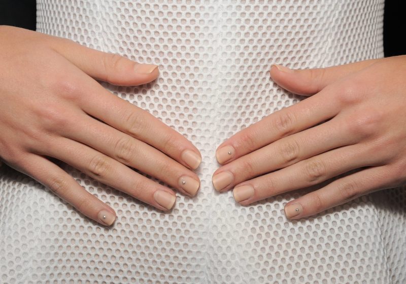 Minimalistic nude manicure with broths