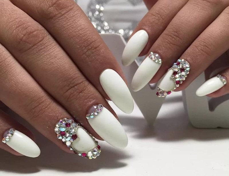 Matte white design with colored rhinestones, holes and broths