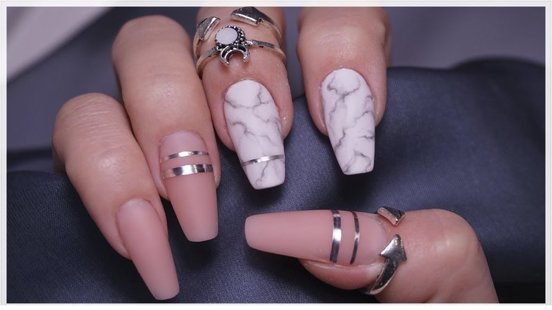 Nude manicure and marble accent