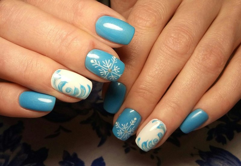 Original winter manicure with snowflakes