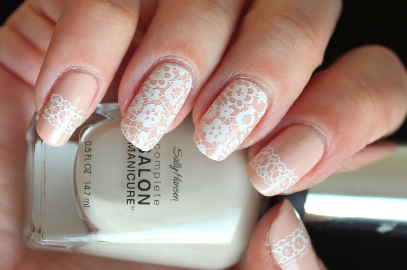 Peach wedding manicure with white lace.