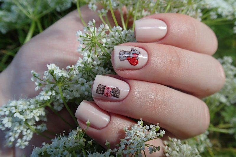 Gentle flesh-colored manicure with stickers for bears