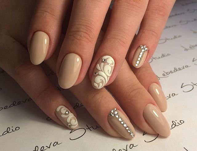 Beige design with white monograms and rhinestones.