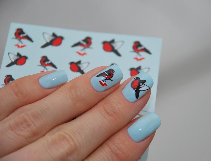 Blue manicure with stickers.