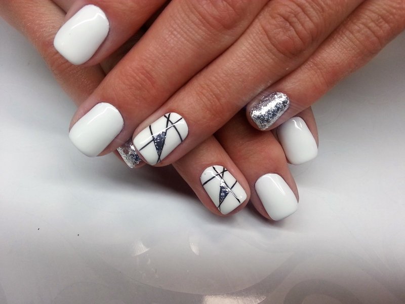 White manicure with geometry and silver glitter.