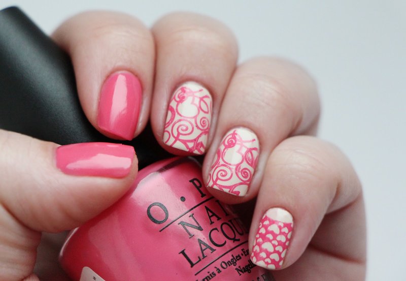 White-pink manicure with stamps.