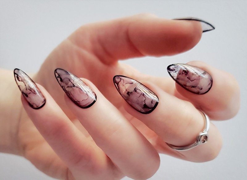 Black stains on transparent nails