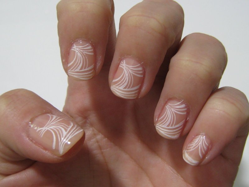 White stamps on nails