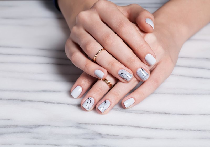 Gray manicure with black stains