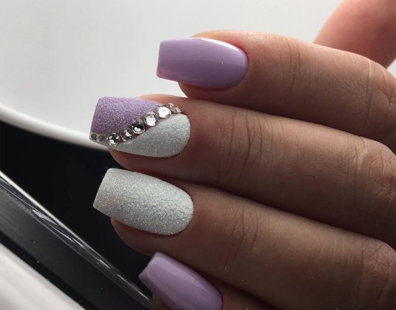 White-lilac manicure with rhinestones