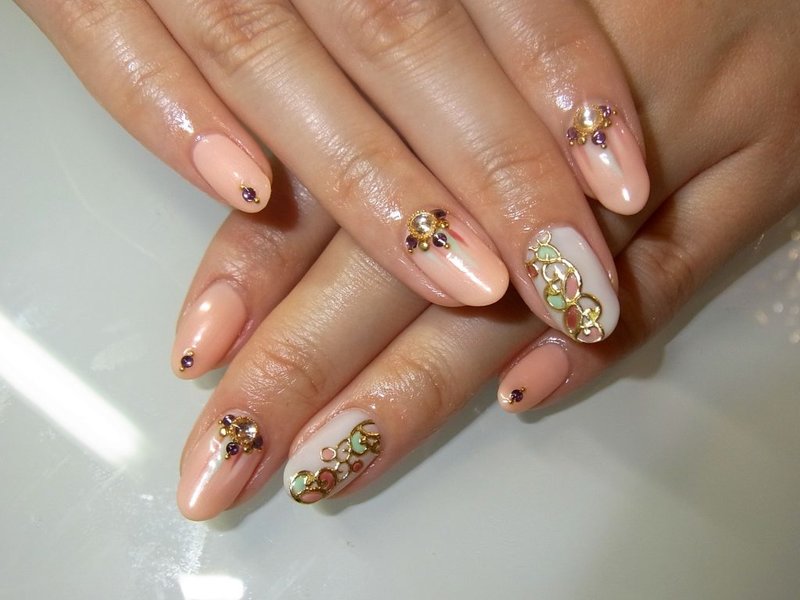 Nude design with colored rhinestones and foil patterns