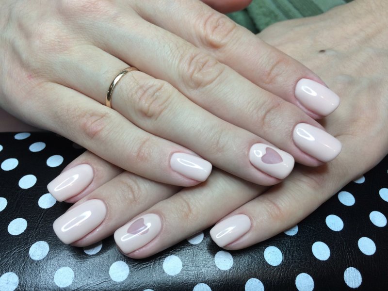 Gentle beige manicure with a heart