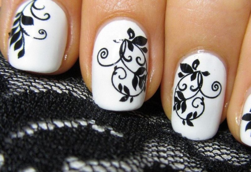 Gentle manicure with a black pattern