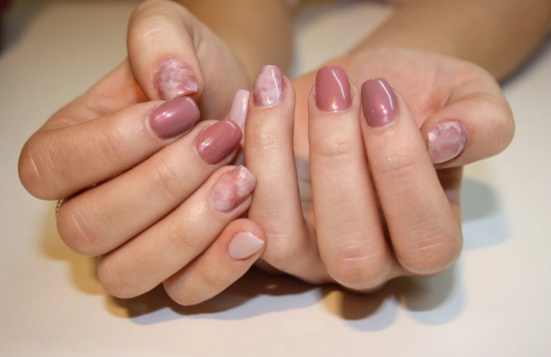 Nude manicure with stains