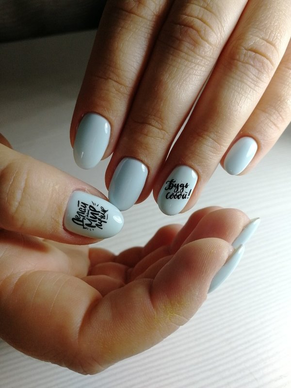 Blue nails with inscriptions