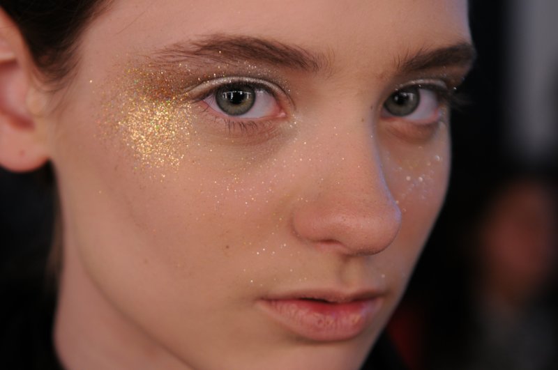 Gold glitter face makeup