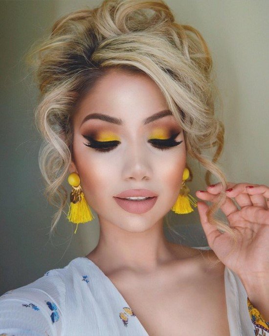 Bright evening makeup in yellow tones for blondes