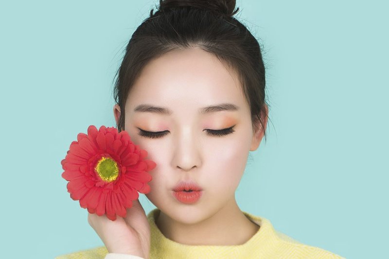 Korean woman with a flower