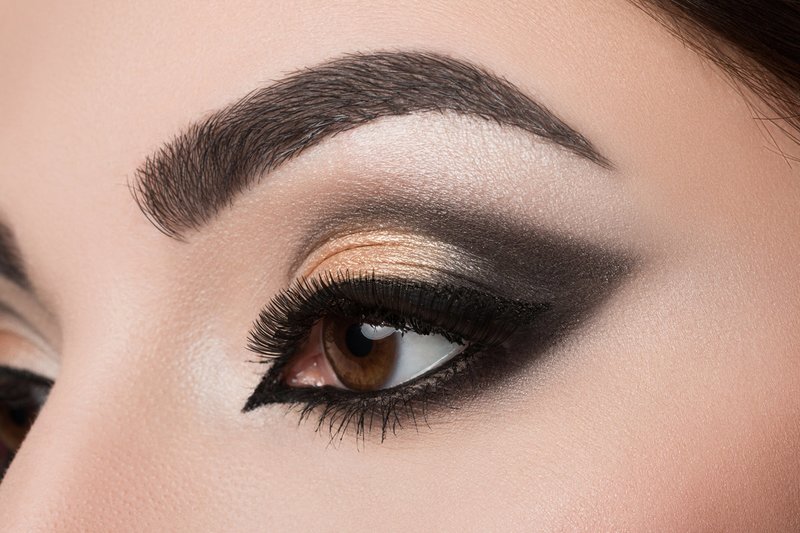 The technique of cat's eye in golden and black colors.