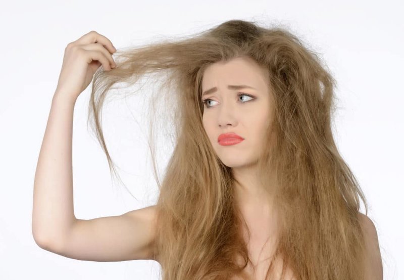 Girl with brittle, dry hair