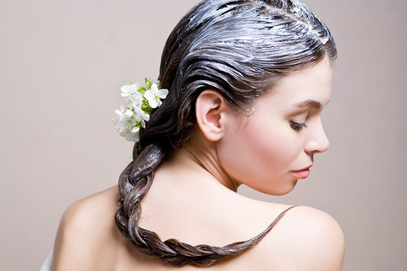 Girl with a nourishing mask on her hair