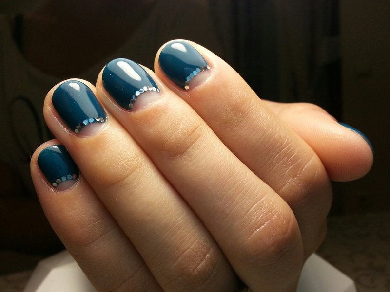 Blue manicure with holes