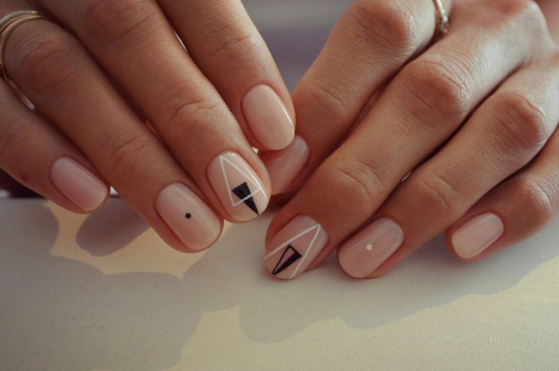 Nail manicure with triangles.