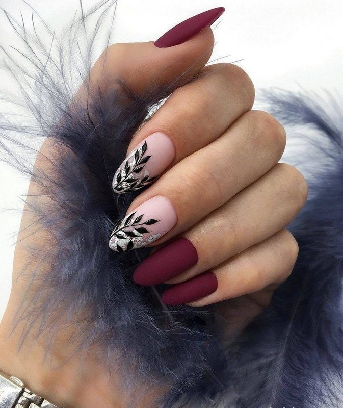 Black and white flowers manicure and burgundy velvet