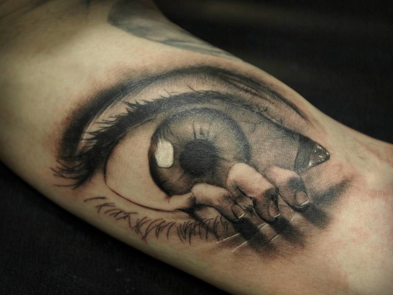 Evil eye tattoo