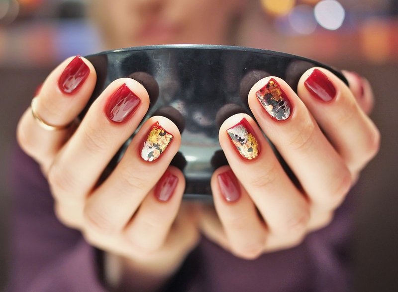 Red manicure with foil