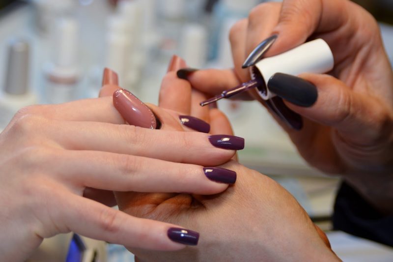 Applying shellac on nails