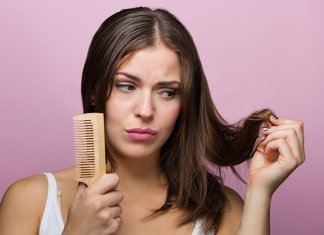 Girl combing her hair