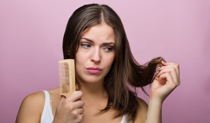 Girl combing her hair