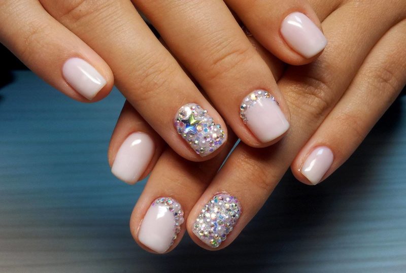 Pale pink manicure with rhinestones