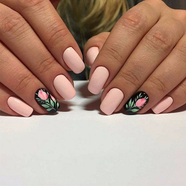 Manicure nude with flowers on a black base.