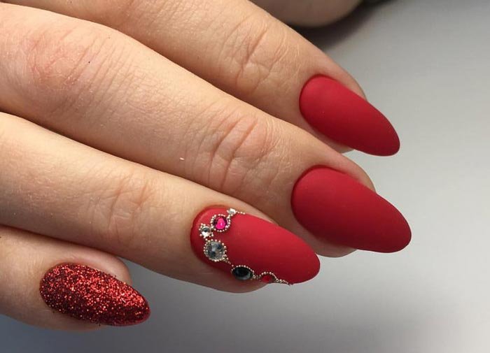 Matte manicure with rhinestones in red shades