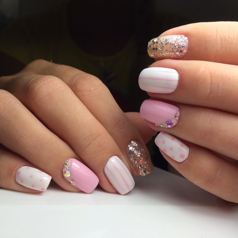 Pale pink manicure with shellac and rhinestones