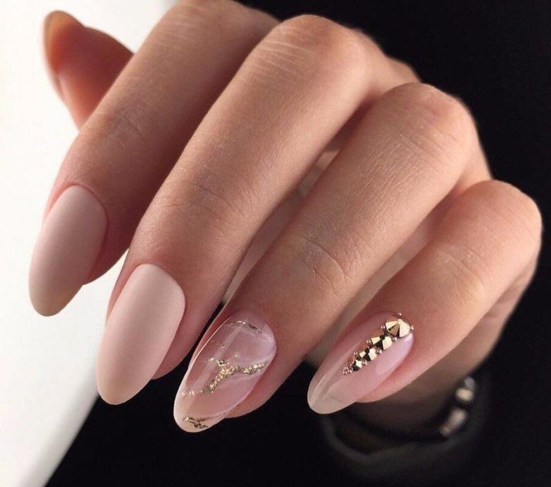 Delicate manicure with shellac and rhinestones