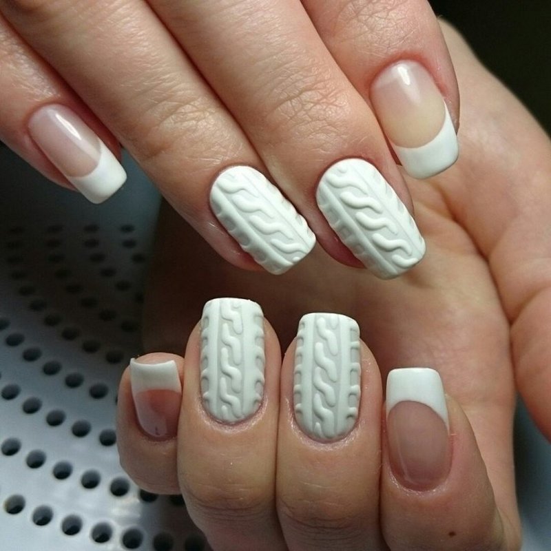 Knitted manicure on a white base