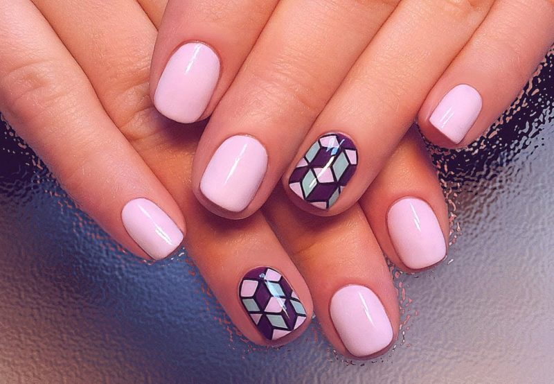 Pink manicure with abstraction.