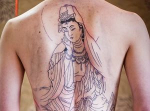 Buddhist amulet tattoo