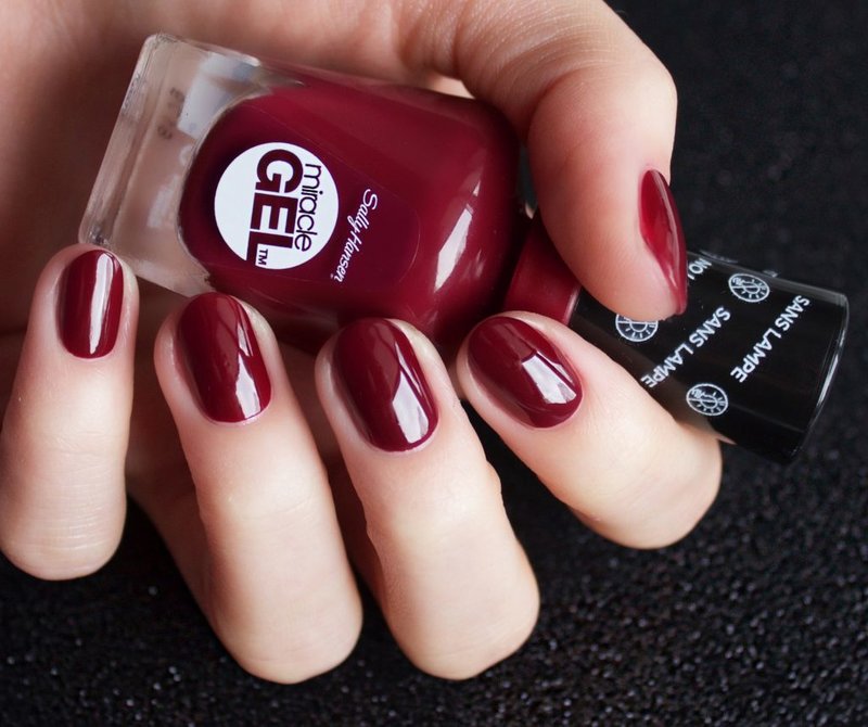 Burgundy gel polish on short nails